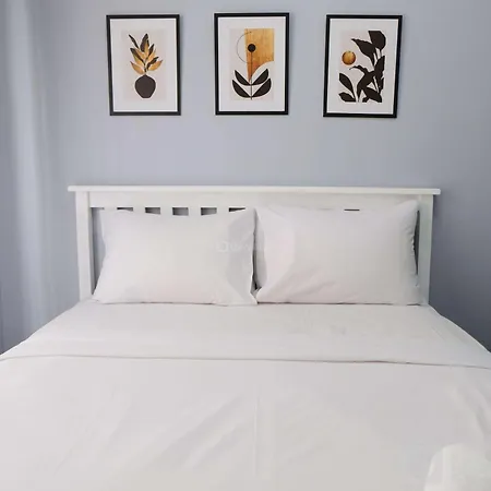 Minimalist Studio At Grand Asia Afrika Apartment By Travelio